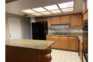 7237 WOODVILLE CRESCENT, ORLANDO, FL 32819 Sold 02/03/23