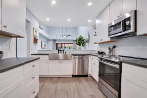 7736 WINDBREAK ROAD, ORLANDO, FL 32819 - MLS#MFRO6355365