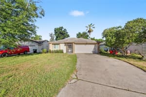 7734 LAKESIDE WOODS DRIVE, ORLANDO, FL 32810 - MLS#MFRO6405647