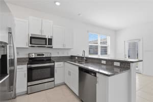 14373 EASY GOER STREET, SUN CITY CENTER, FL 33573 - MLS#MFRTB8483755