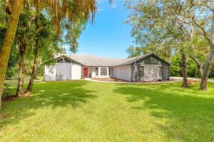 5803 SPRUCE CREEK WOODS DRIVE, PORT ORANGE, FL 32127 Sold 09/16/24