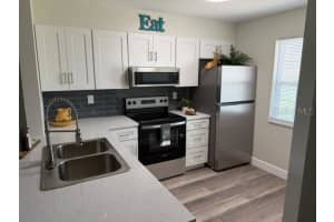 11130 CARRIAGE HILL UNIT 1 DRIVE, PORT RICHEY, FL 34668 - MLS#MFRW7886103